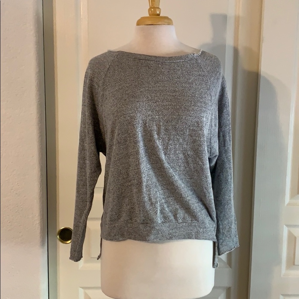 Gray sweater with a cutout design down the back